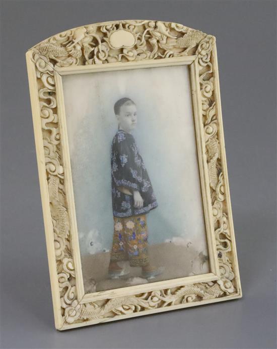 Chinese School, late 19th century, portrait miniature of a boy in an ivory frame, 14.8cm x 10.3cm